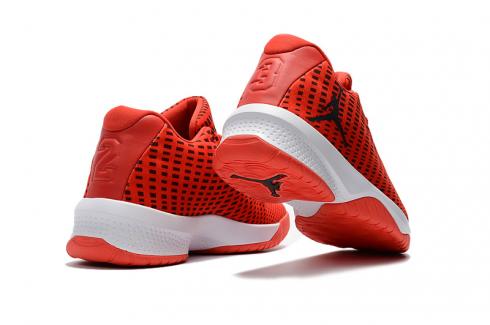 orange and black jordan basketball shoes