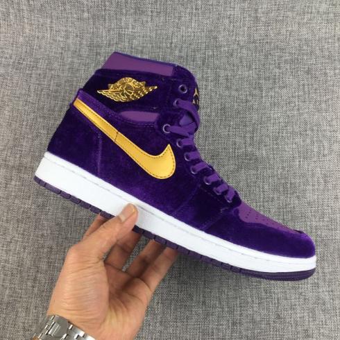 gold and purple nike shoes