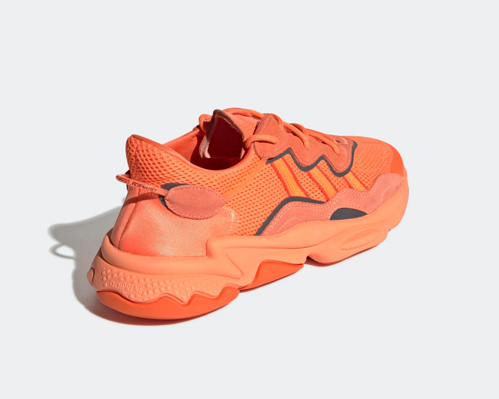 pink and white adidas slides