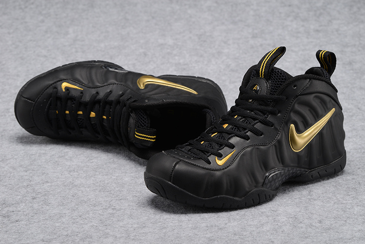 yellow and black nike foams