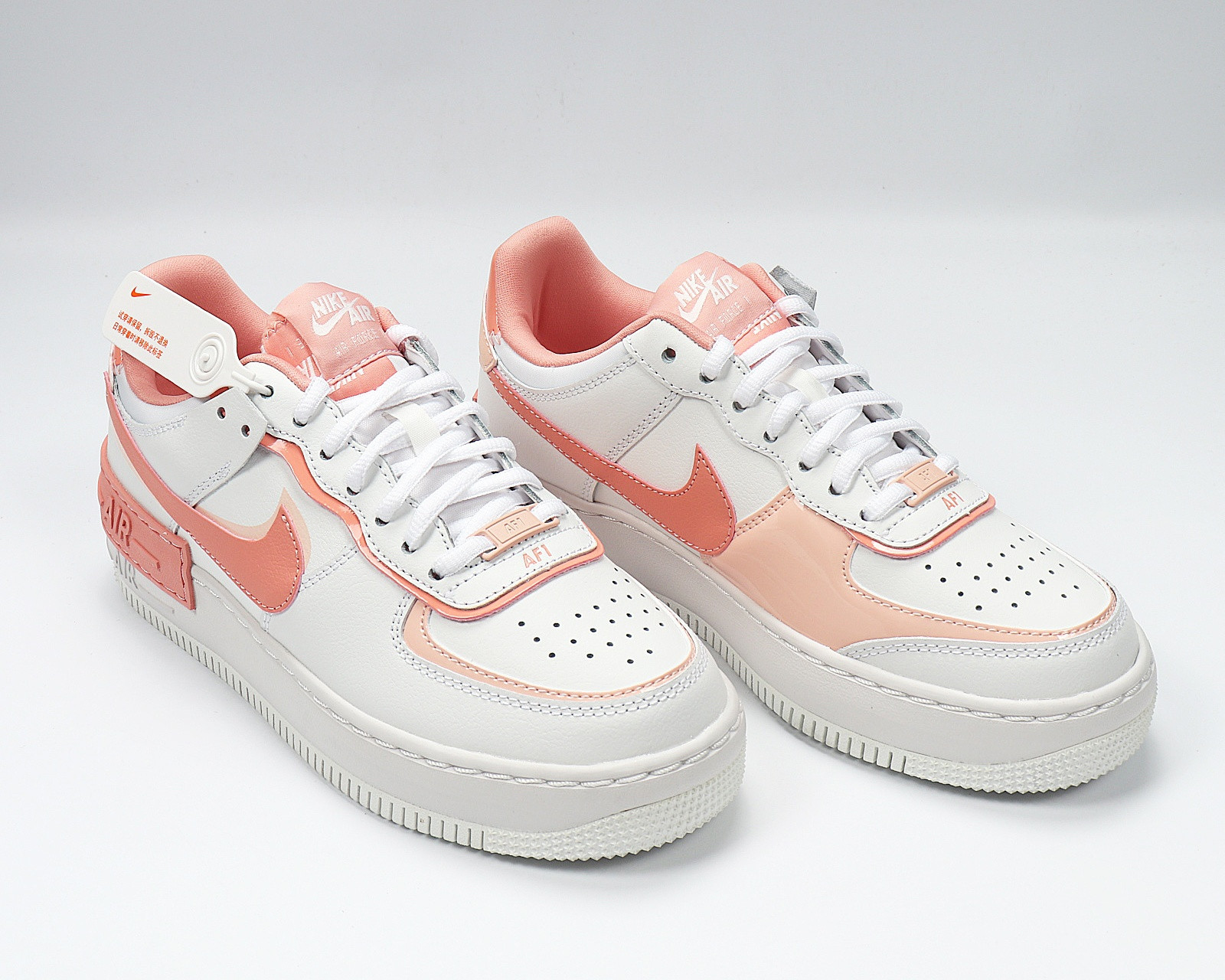 white nike air force 1 with pink bottom