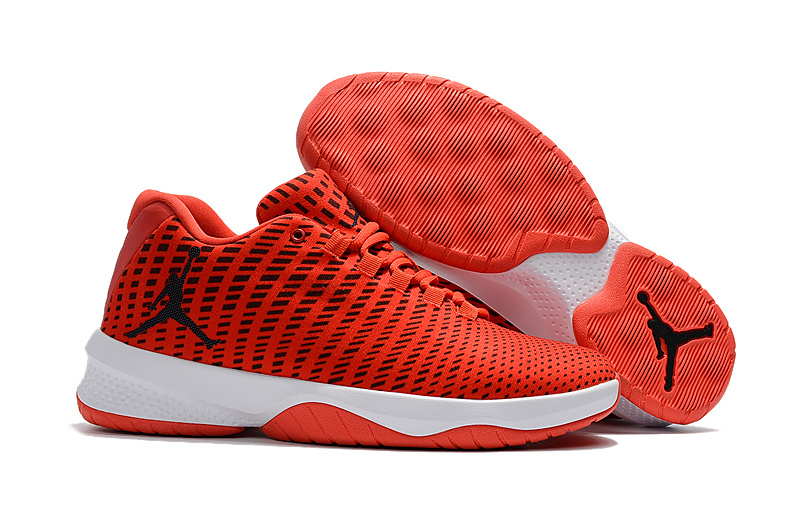 orange and black jordan basketball shoes