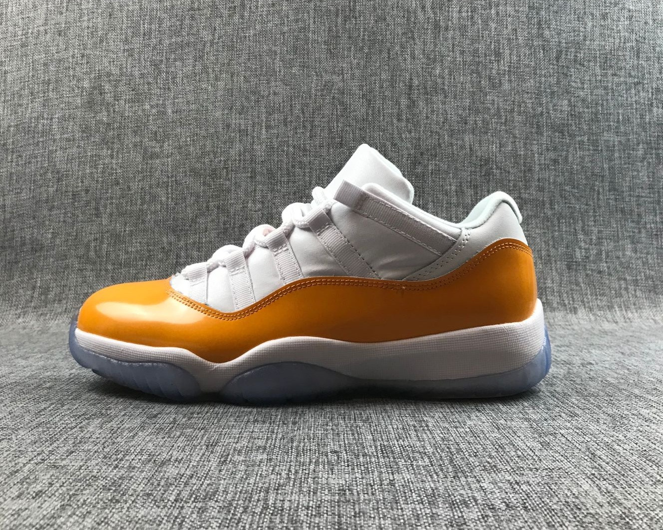 low top 11s orange and white