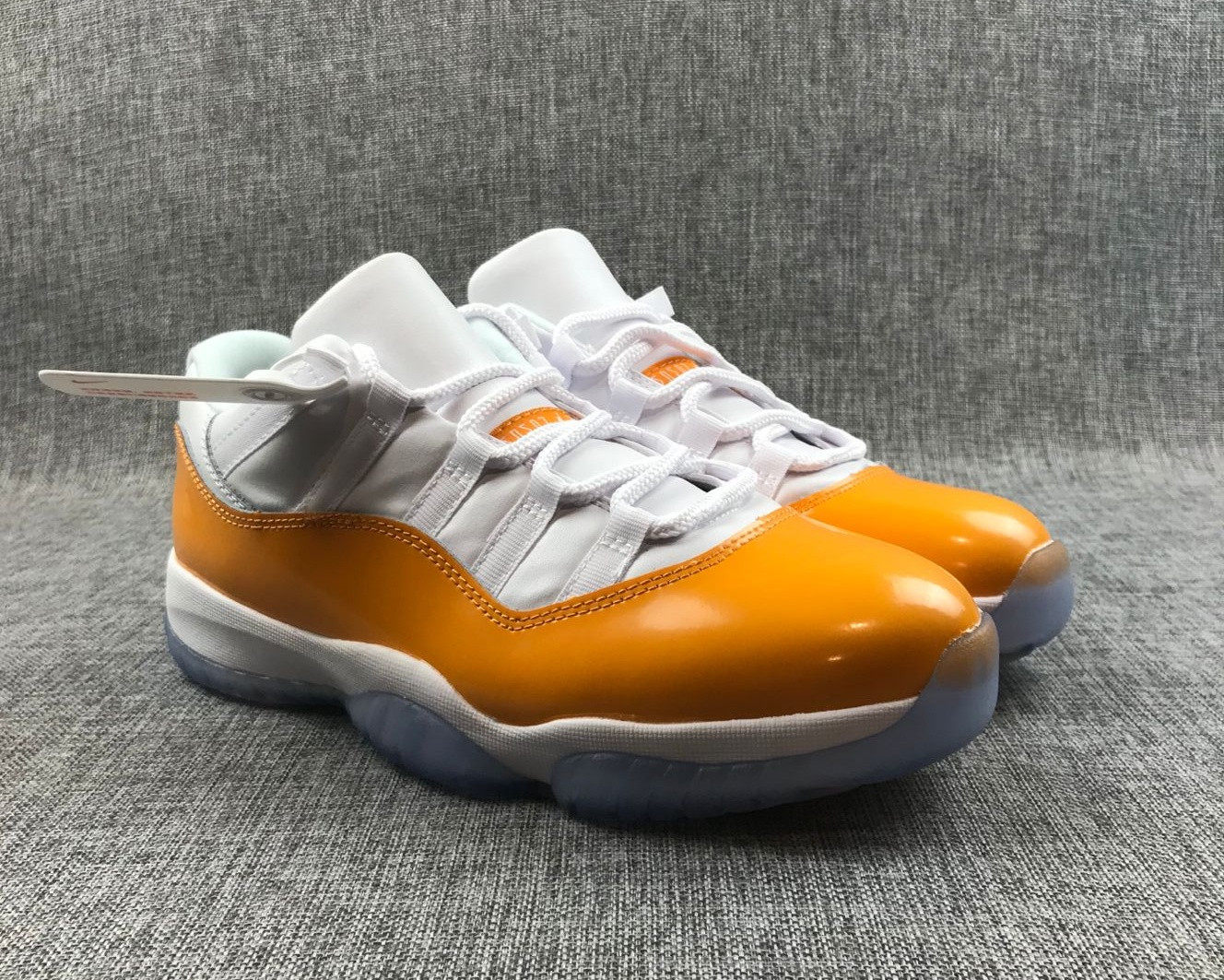 low top 11s orange and white