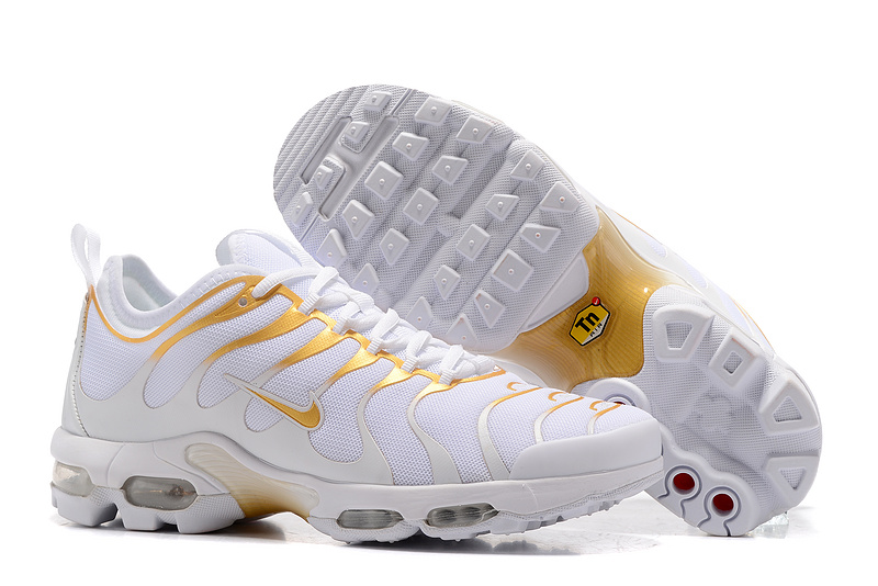 white and yellow air max plus