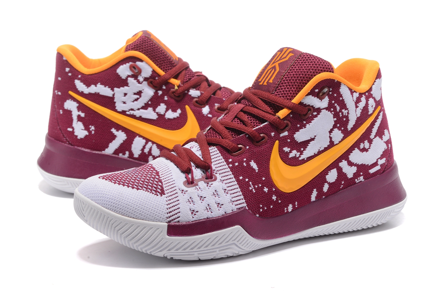 white and yellow basketball shoes